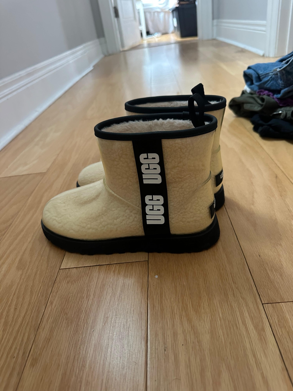 UGG Cream Shearling Ankle Boots with Black Trim and Branded Pull Tab